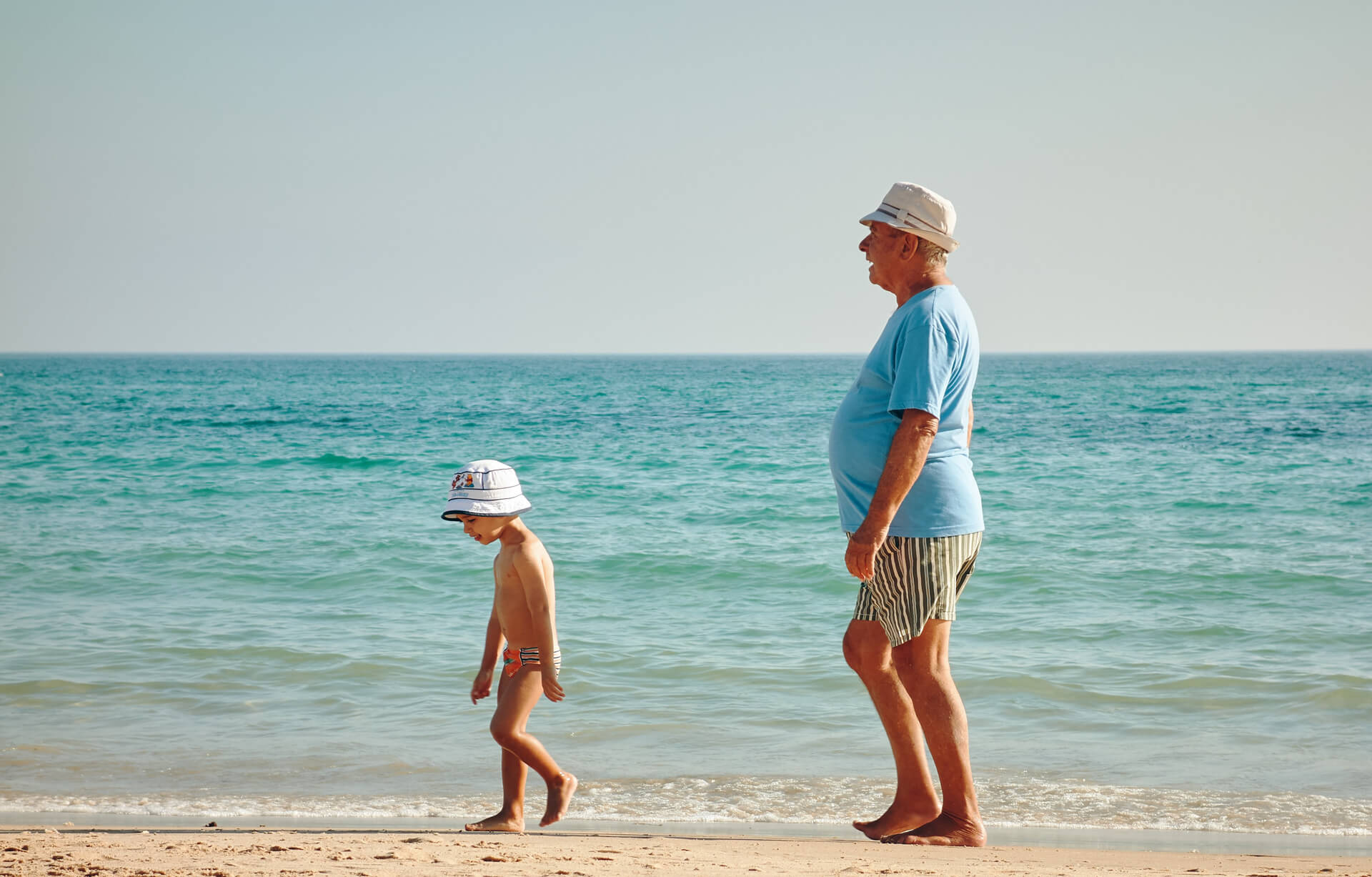 A person standing on a beach

Description automatically generated